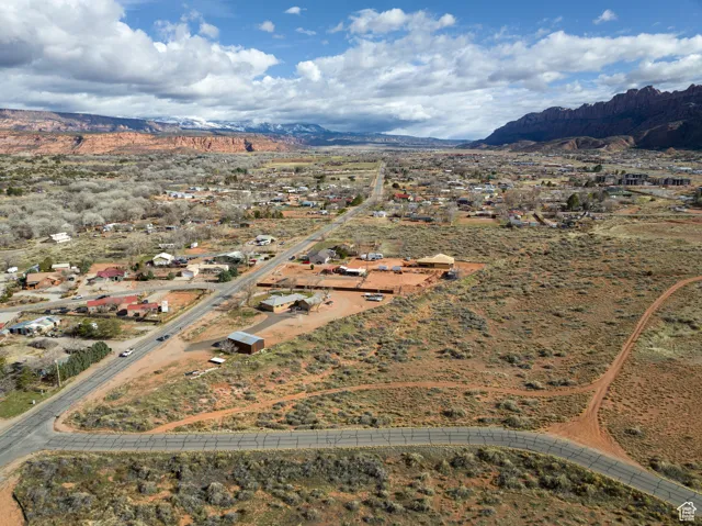 Aerial view of property and surrounding area with mountains and rural landscape