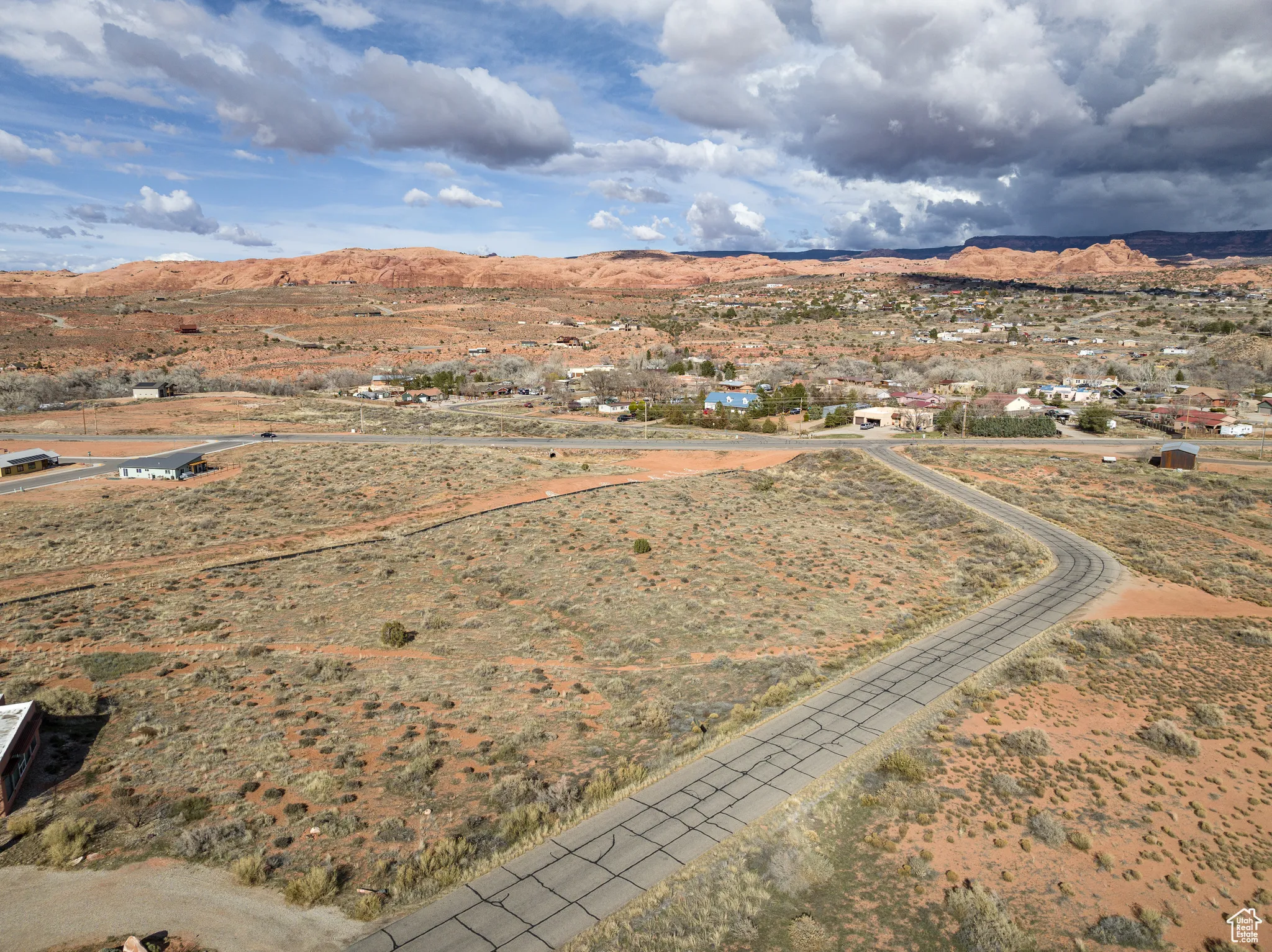 Overview of rural landscape with a mountain backdrop and a desert landscape