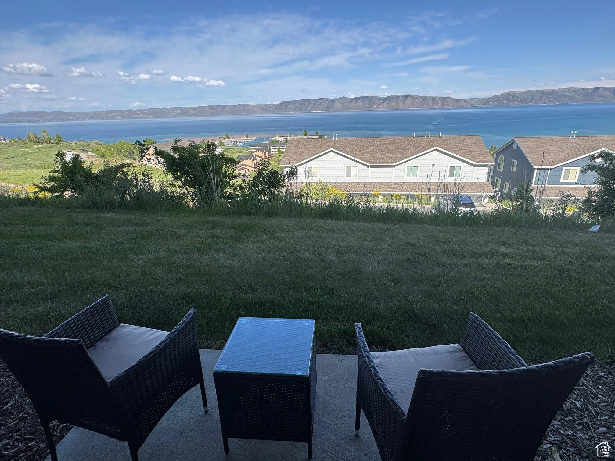 View of yard with a water and mountain view