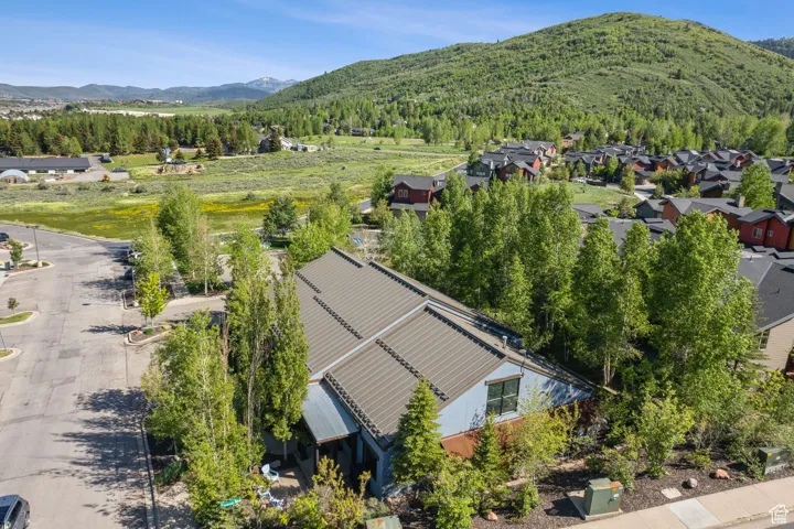Aerial view of residential area featuring a mountainous background