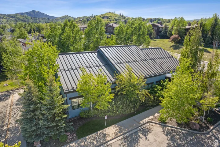 View from above of property with a mountain backdrop