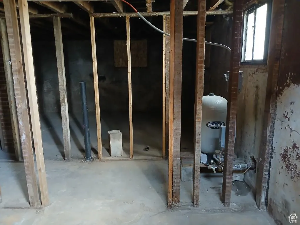 Below grade area with a water pressure tank