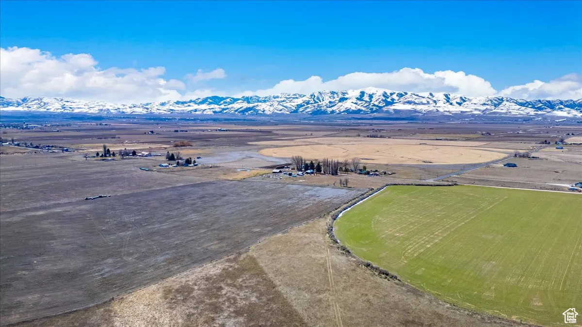 Aerial view of sparsely populated area featuring a mountainous background