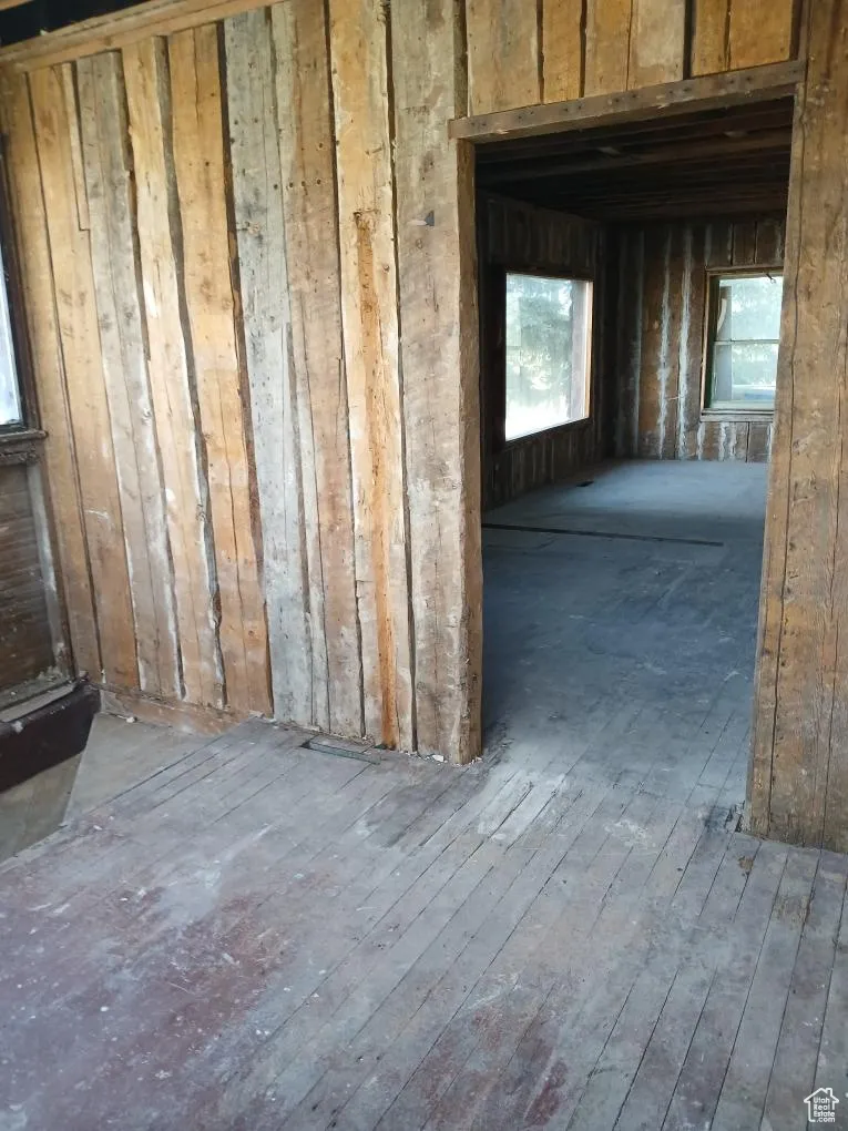Miscellaneous room featuring plenty of natural light and hardwood / wood-style floors