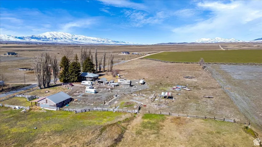 Aerial view of sparsely populated area featuring a mountainous background
