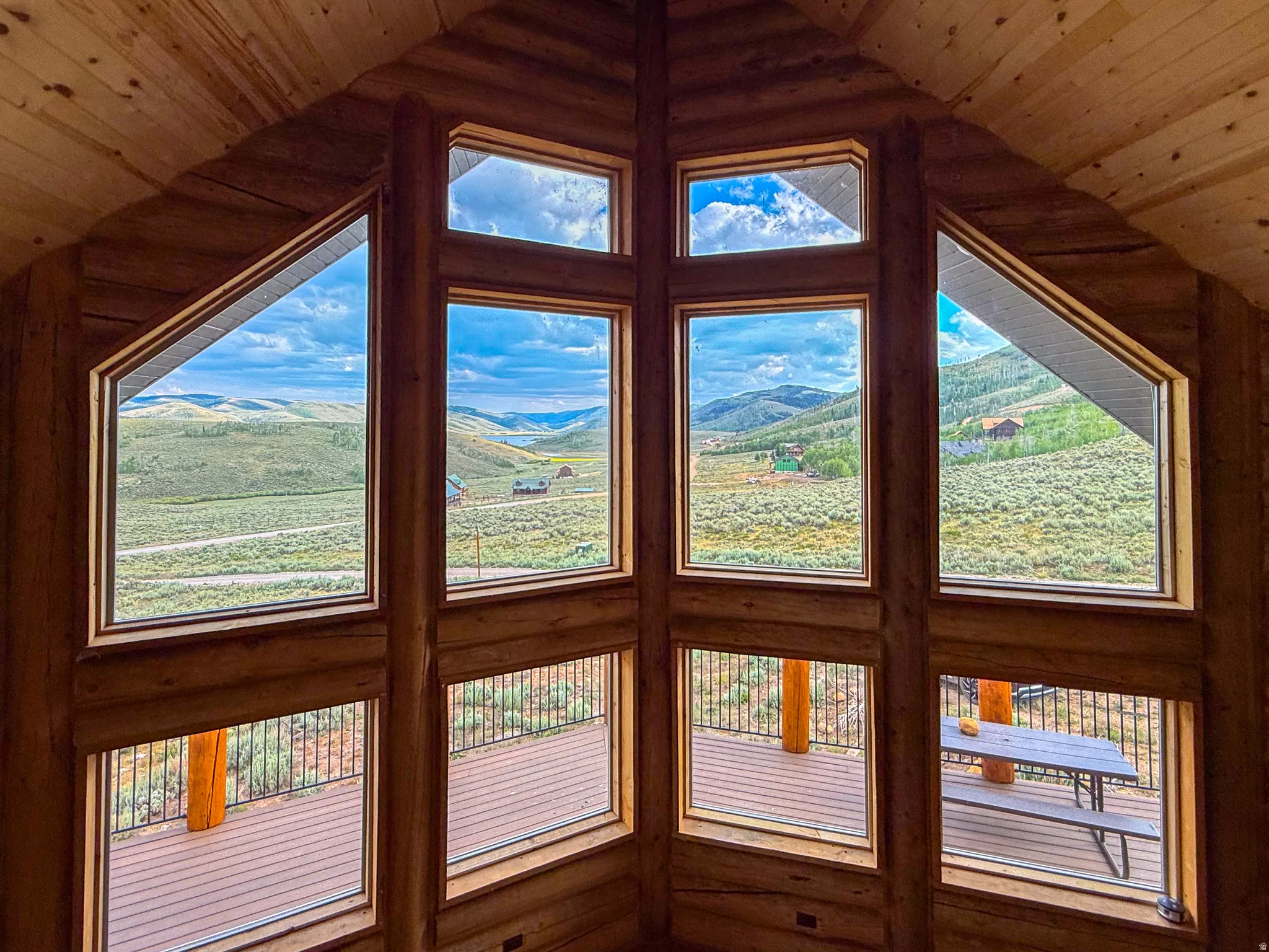 Grand wall of windows showcasing expansive mountain scenery