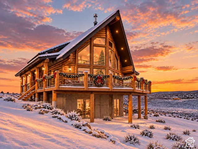 Would you like to spend the holidays at your own cabin? Log-style exterior featuring a prominent A-frame structure and expansive windows