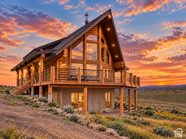 Log cabin construction with a gable roof and exposed log beams