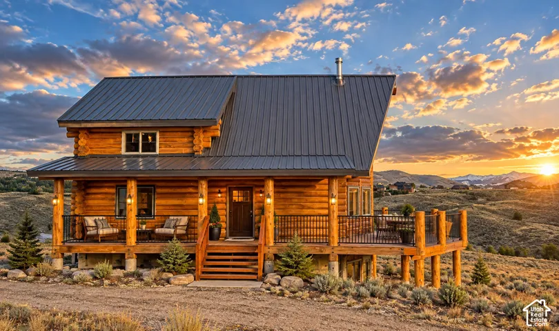 Log cabin exterior with a metal roof
