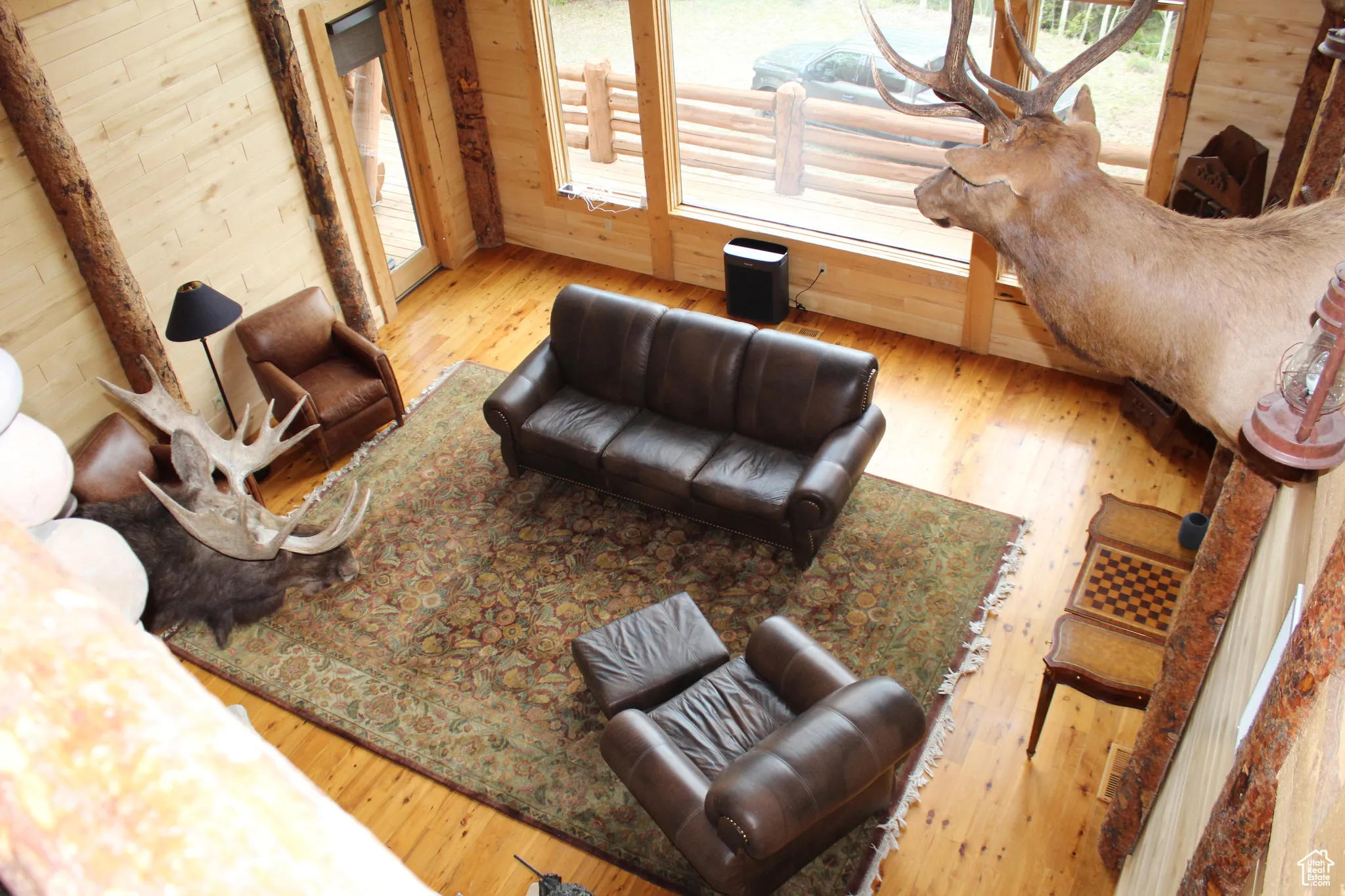 Living area featuring wood walls and wood-type flooring