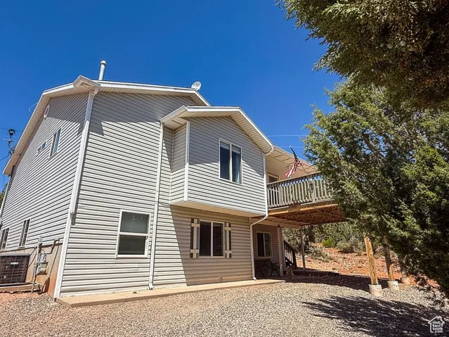 Rear view of house with a deck