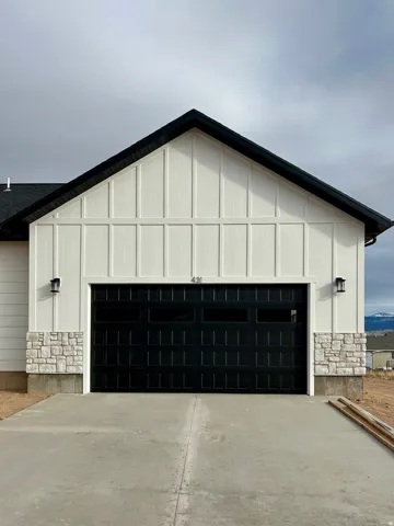 Garage featuring driveway