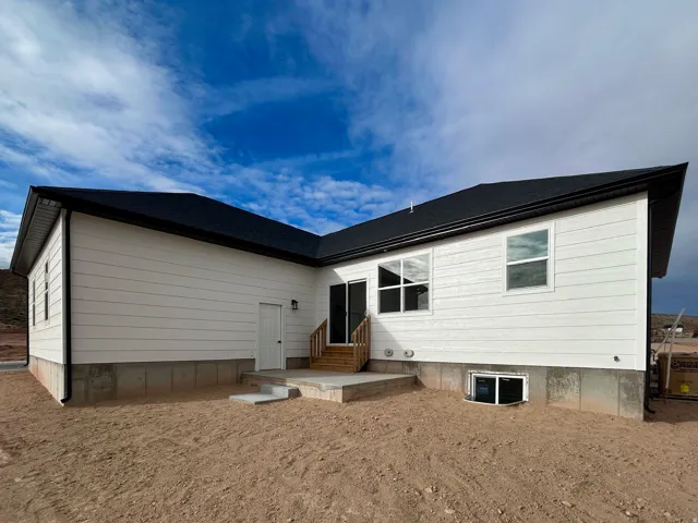 Rear view of property with entry steps