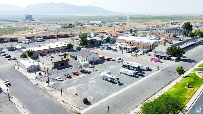 Aerial view of an industrial area and a mountainous background