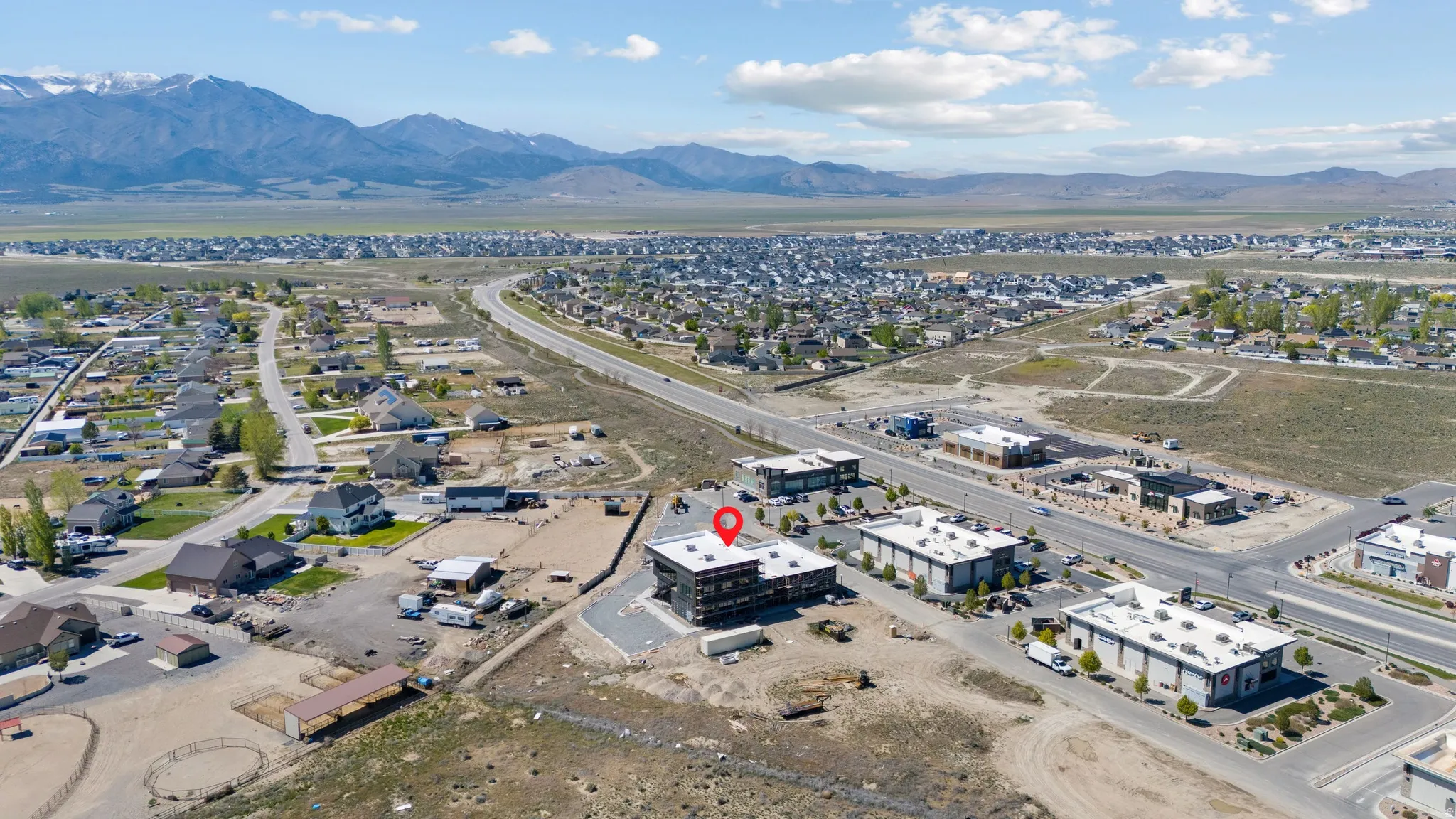 Aerial perspective showcasing the commercial property and surrounding area
