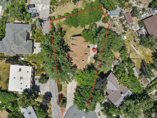 Aerial view of property and surrounding area featuring property parcel outlined
