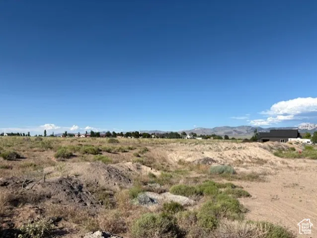 View of undeveloped land featuring rural landscape and a mountainous background