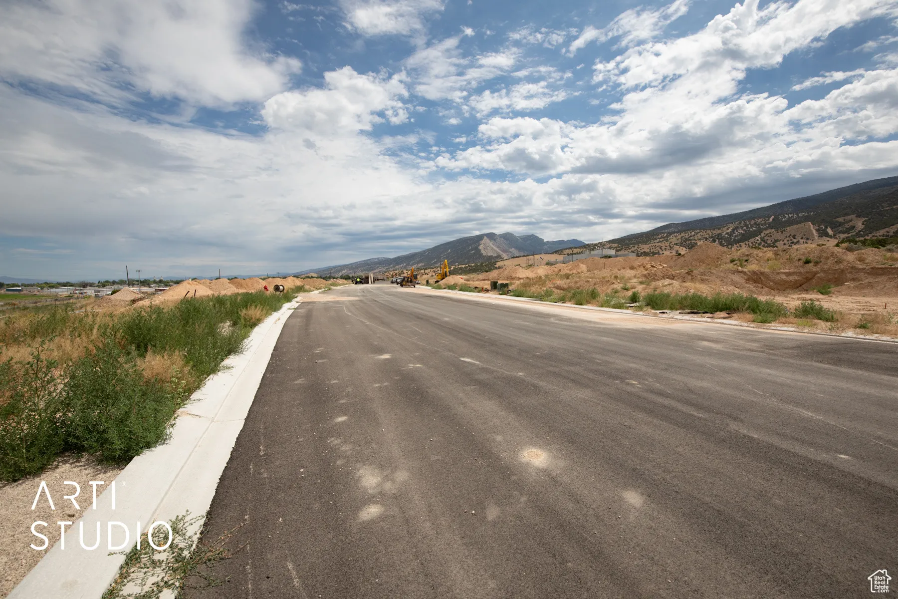 View of asphalt street with a mountain view