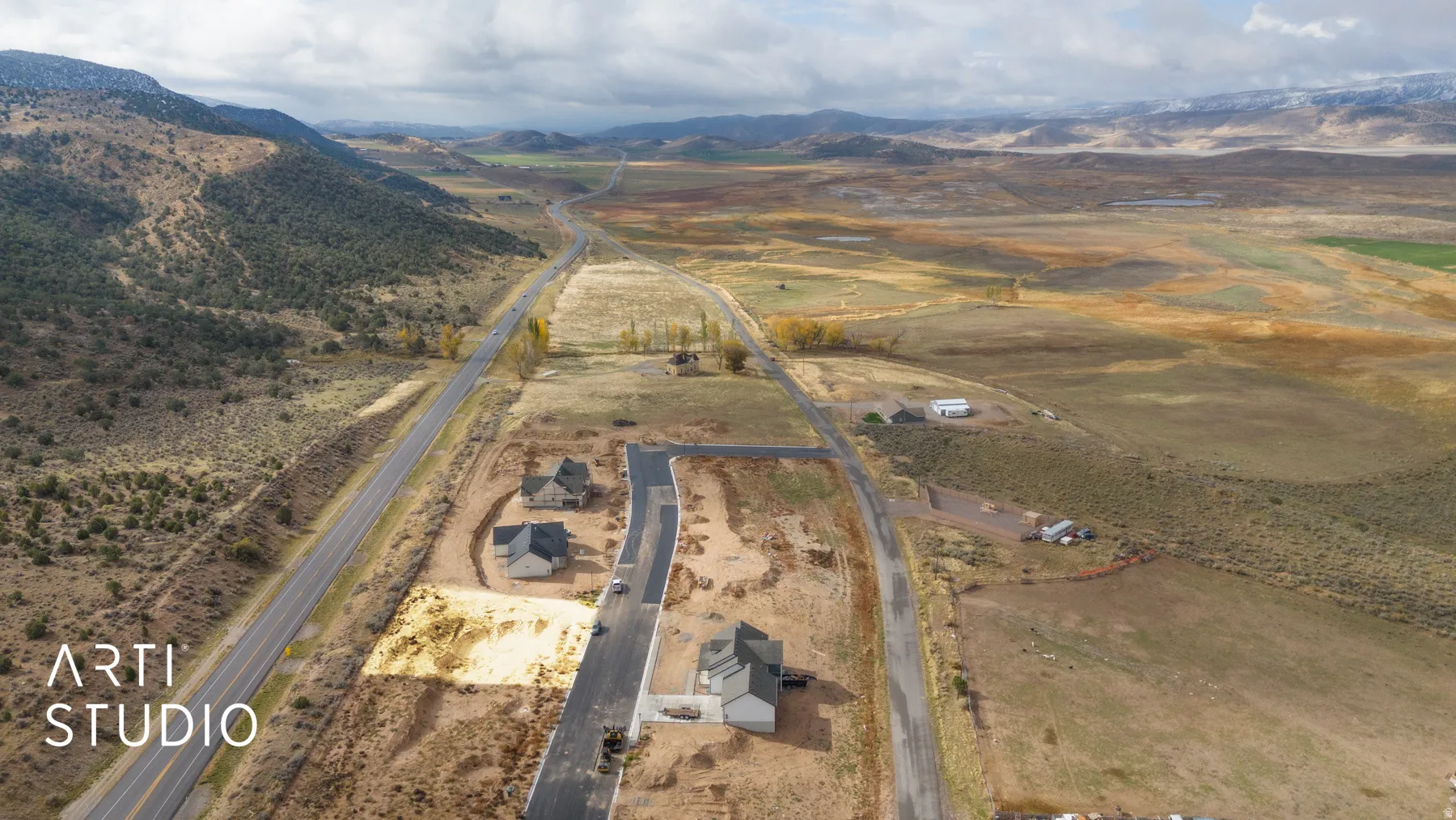 Aerial view of sparsely populated area featuring a mountain backdrop