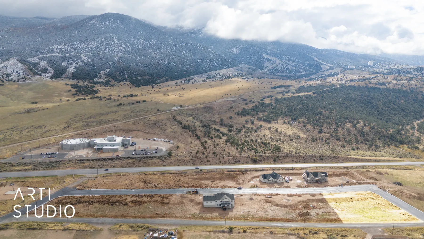 Expansive land parcel featuring a mountain backdrop, potential for development, established road access, and clear boundaries