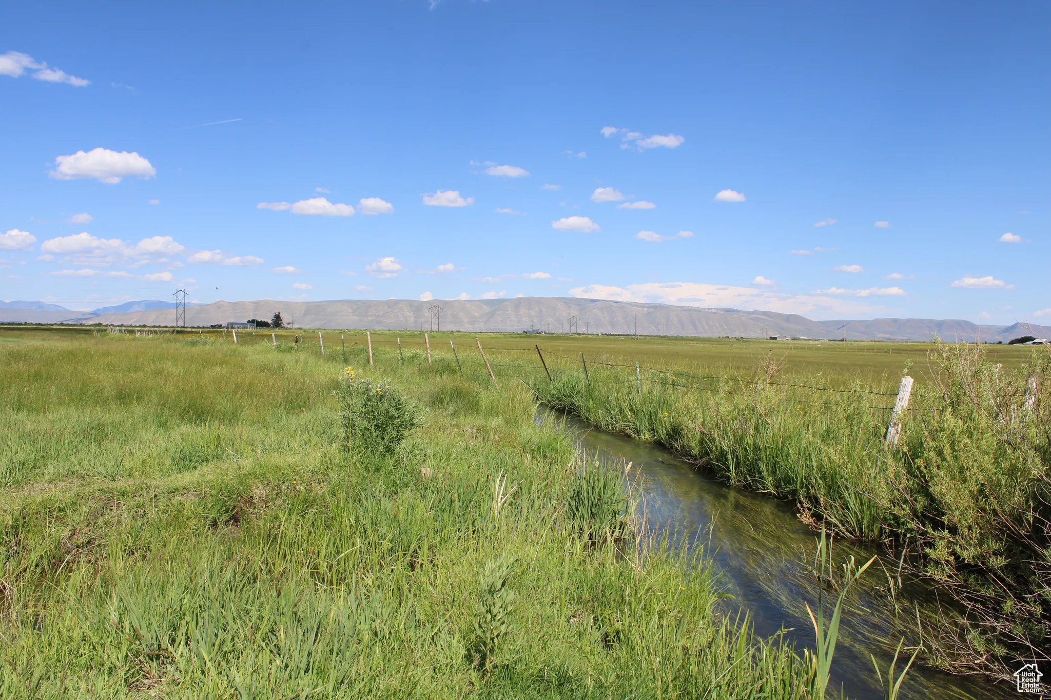 View of mountain backdrop featuring rural landscape