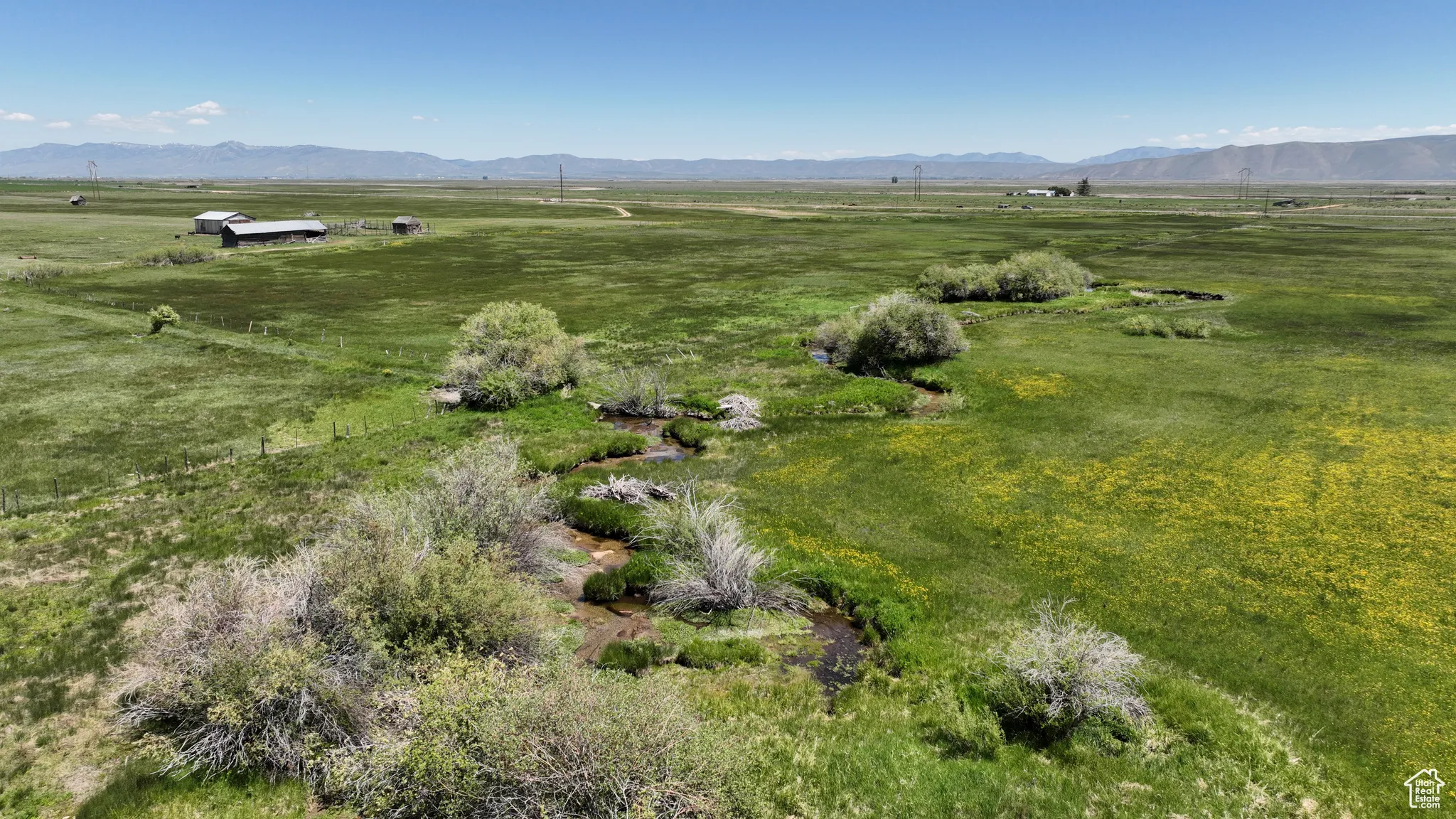 Aerial overview of property's location featuring rural landscape and mountains