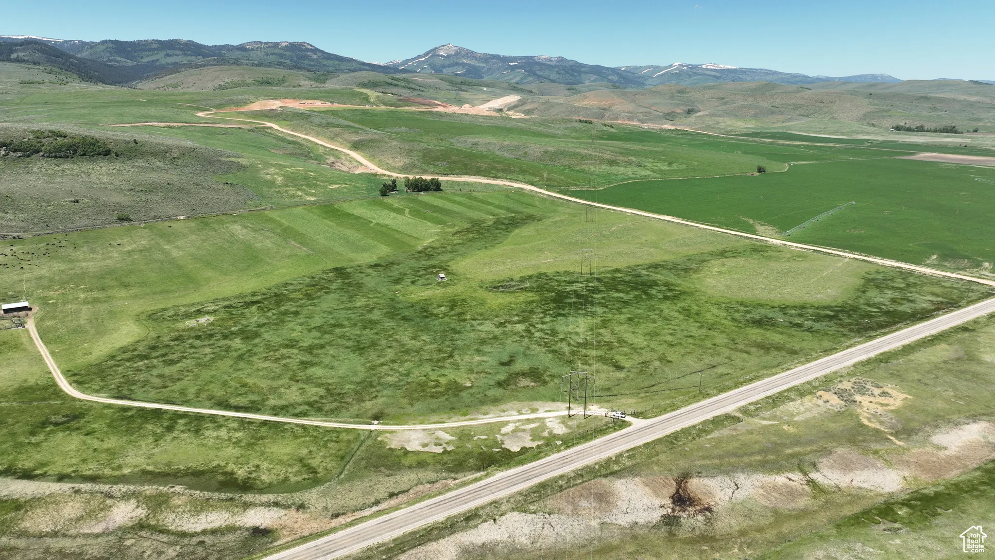 View of mountain backdrop featuring rural landscape