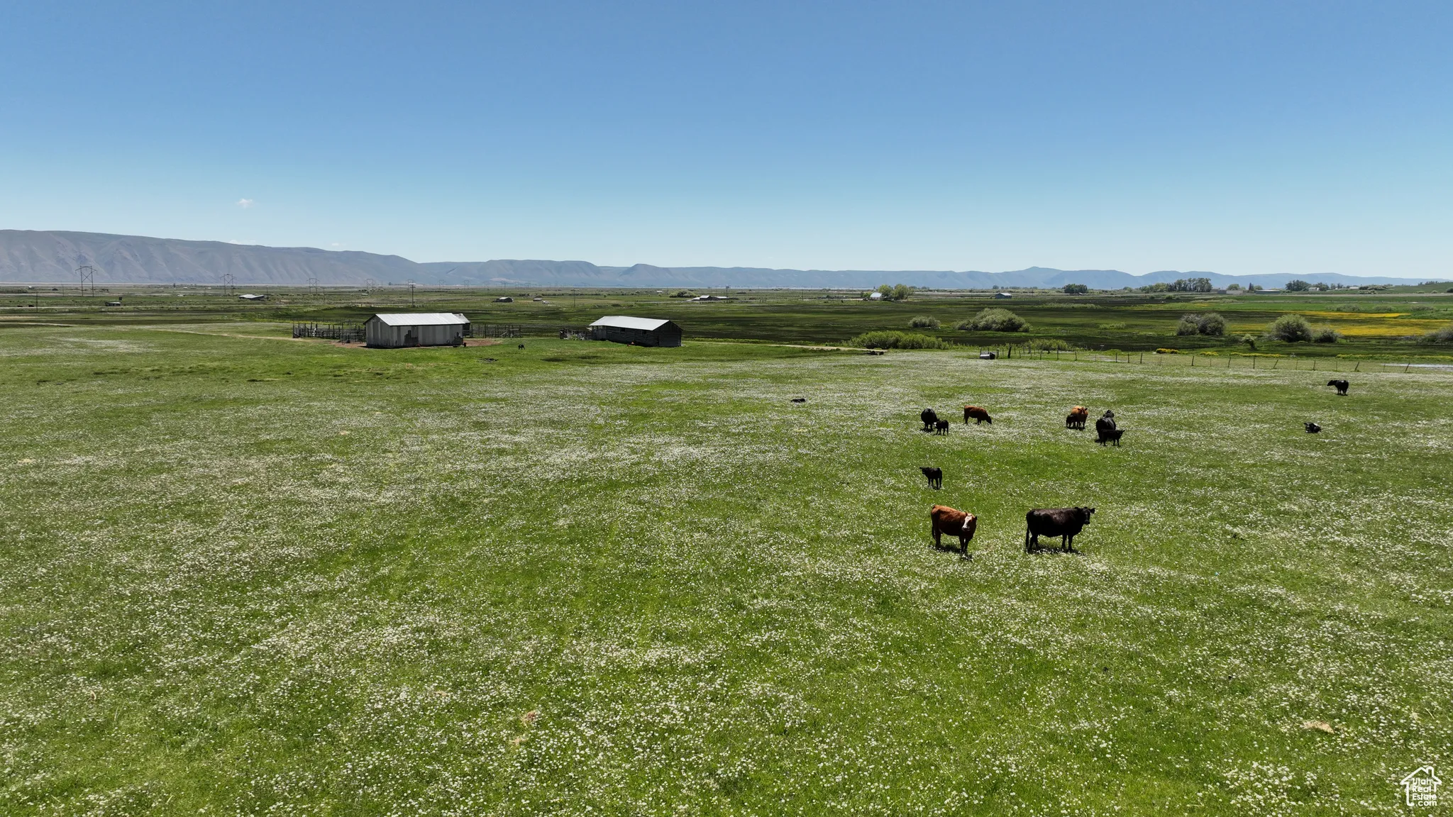 View of mountain backdrop featuring rural landscape and agricultural land