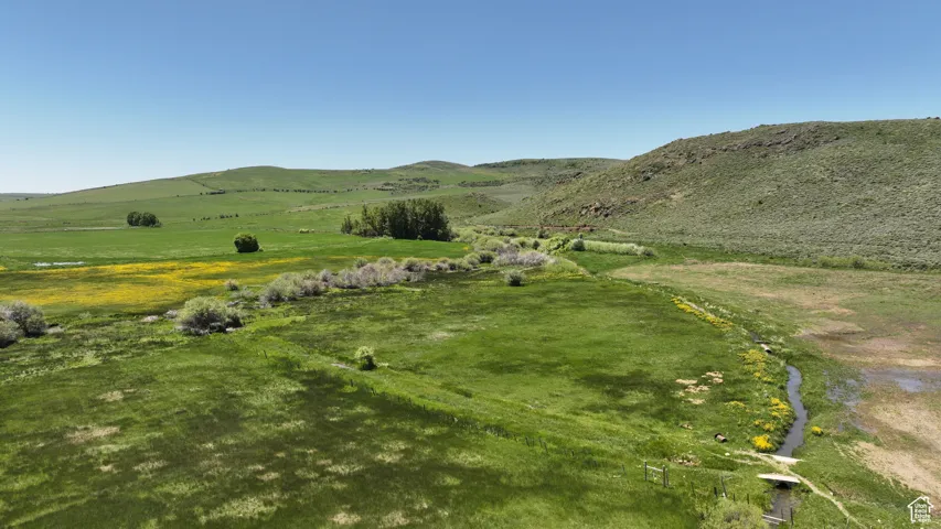 View of mountain backdrop with rural landscape