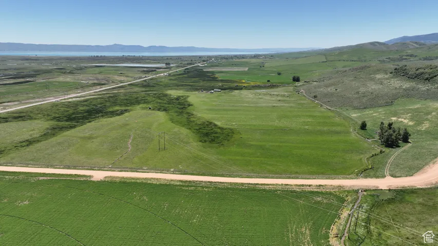 Aerial overview of property's location with rural landscape and mountains