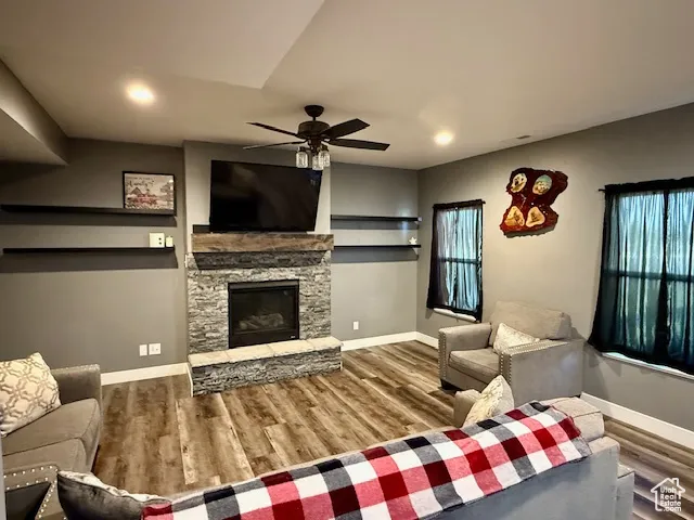 Main floor family room with floating shelves and gas stove.