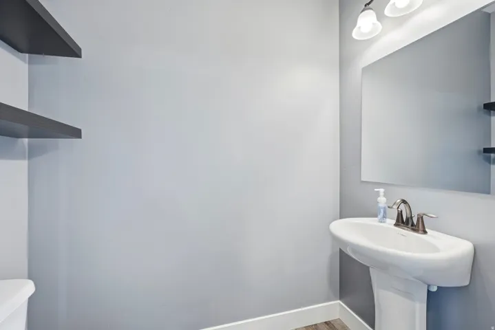 Pedestal sink in the half bath