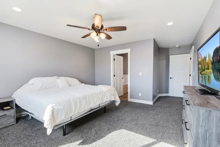 Recessed lighting, ceiling fan with light fixture, gray wall paint, white trim, and gray carpet