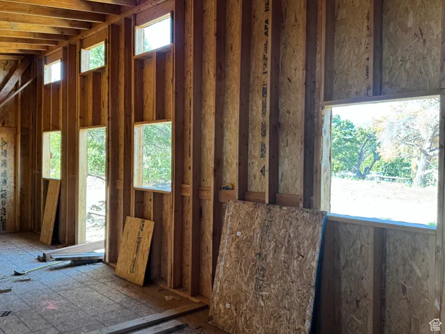 high ceilings in future bunkhouse  featuring plenty of natural light