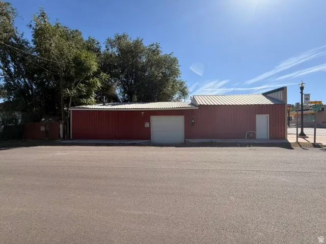 Red metal siding exterior with a metal roof