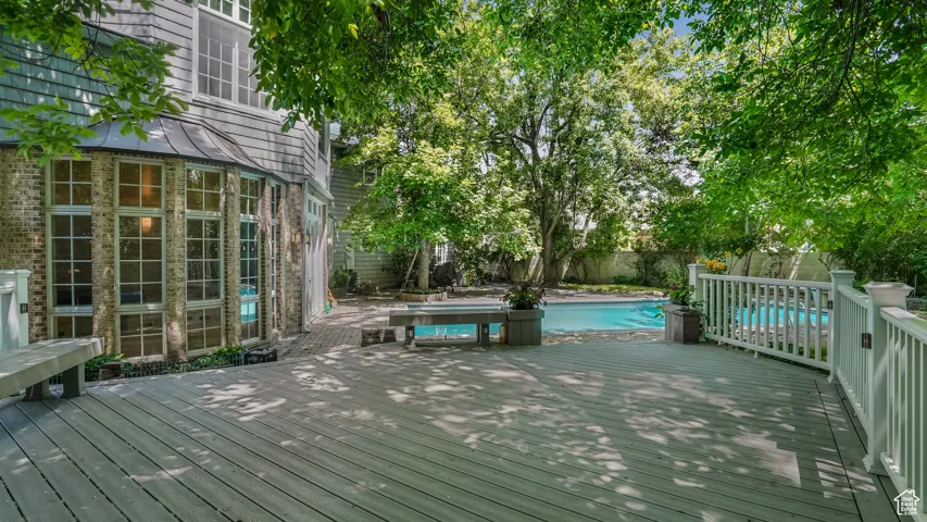 Wooden deck featuring a fenced backyard