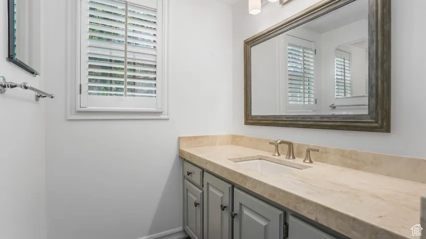 Bathroom with plenty of natural light and vanity