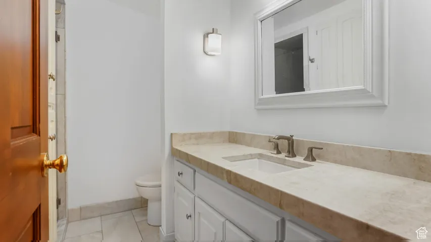 Bathroom with vanity and tile patterned flooring