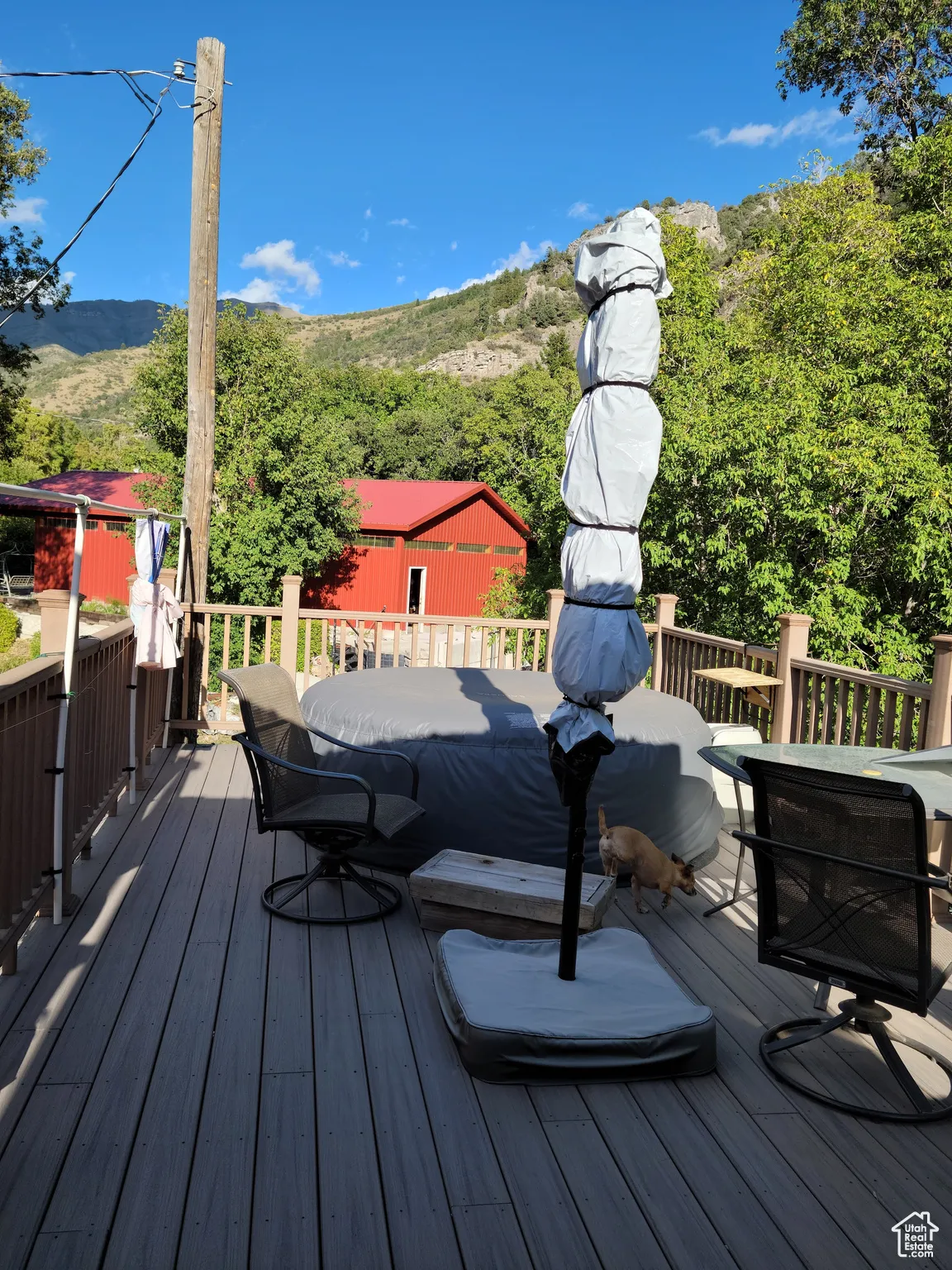 Deck featuring a mountain view and outdoor dining area