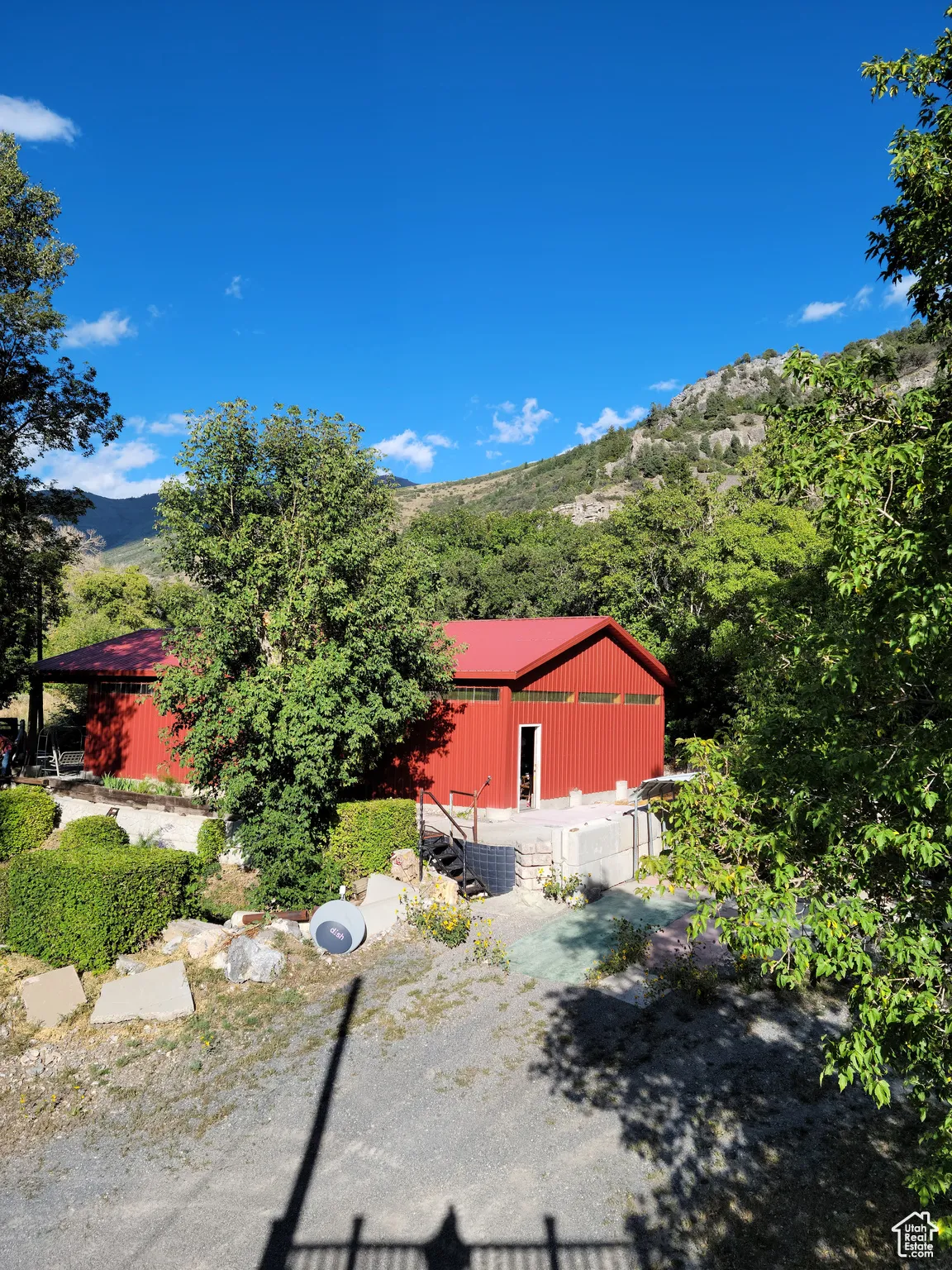 View of side of shop and a mountain view