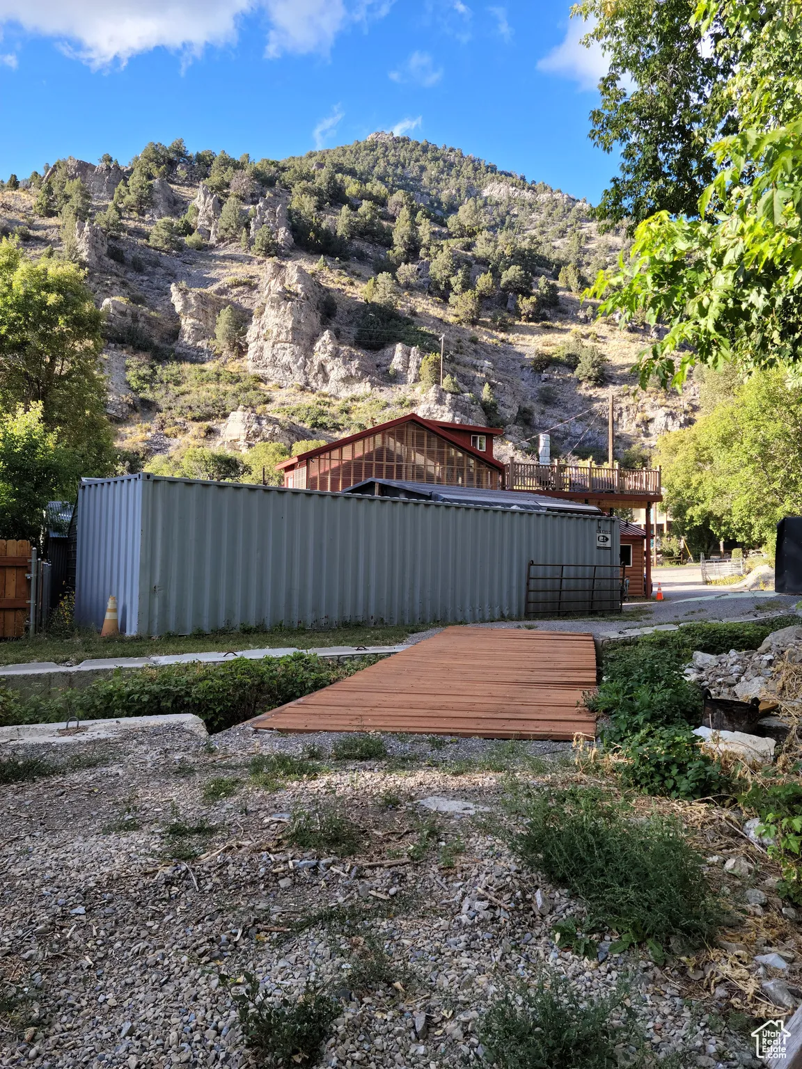 View of 40; conex and bridge with a mountain backdrop