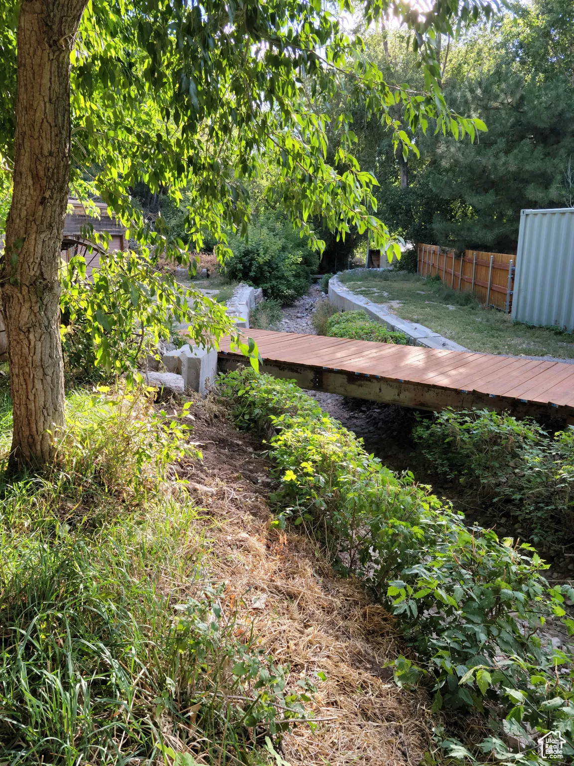 View of yard with a bridge