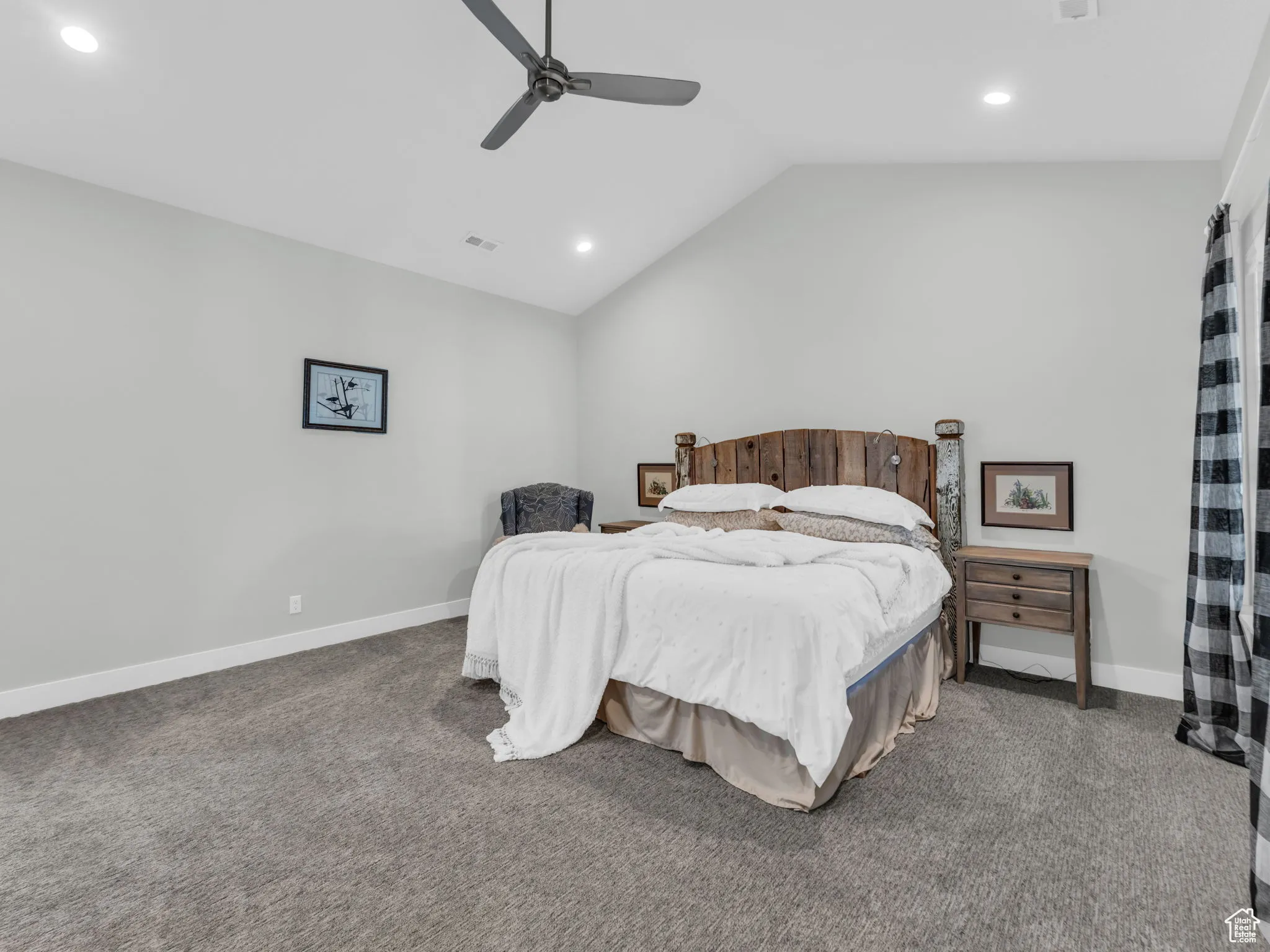 Carpeted bedroom with lofted ceiling, recessed lighting, and ceiling fan