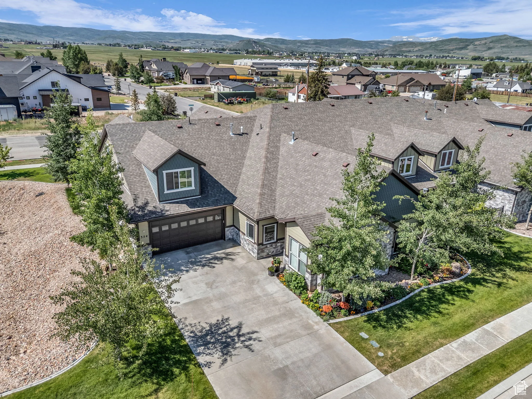 Aerial perspective of suburban area featuring a mountain backdrop