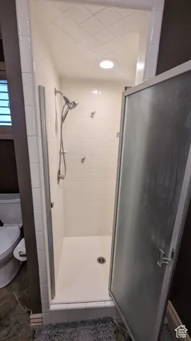 Master Bathroom featuring a stall shower and tile patterned flooring