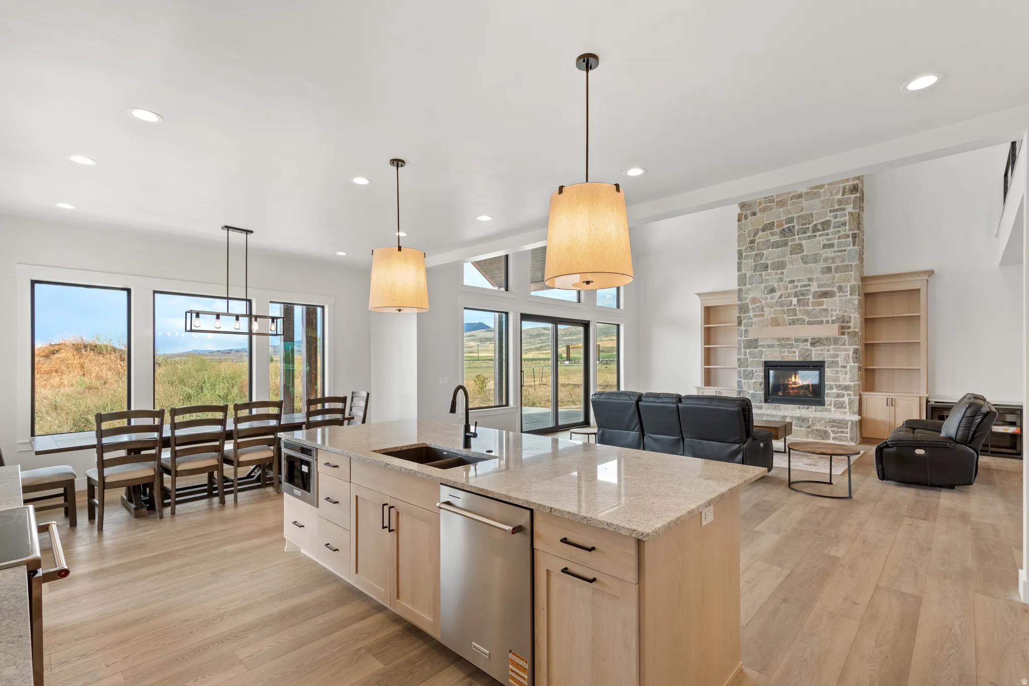 Open-concept living space with wood-finish flooring