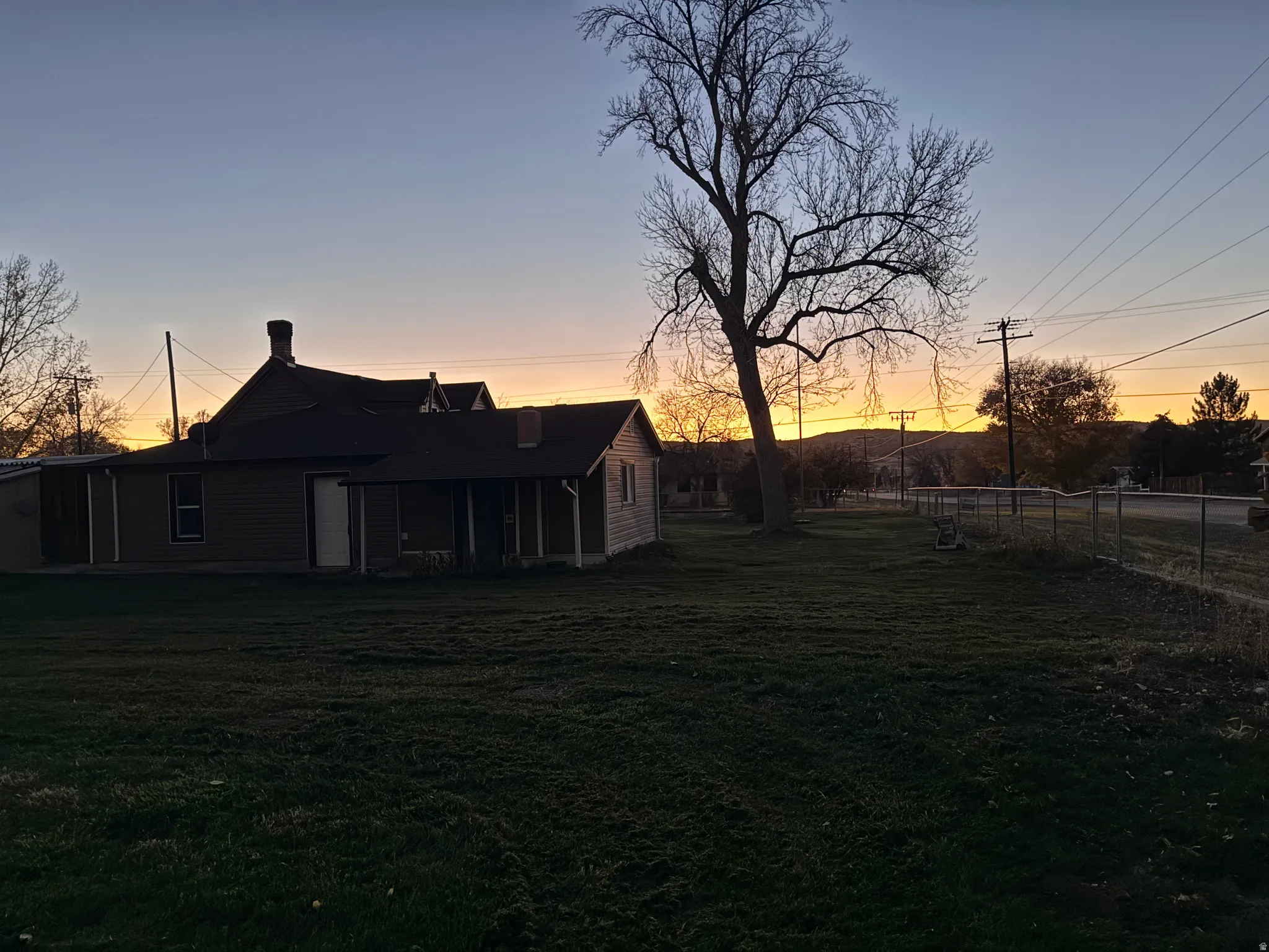View of yard at dusk