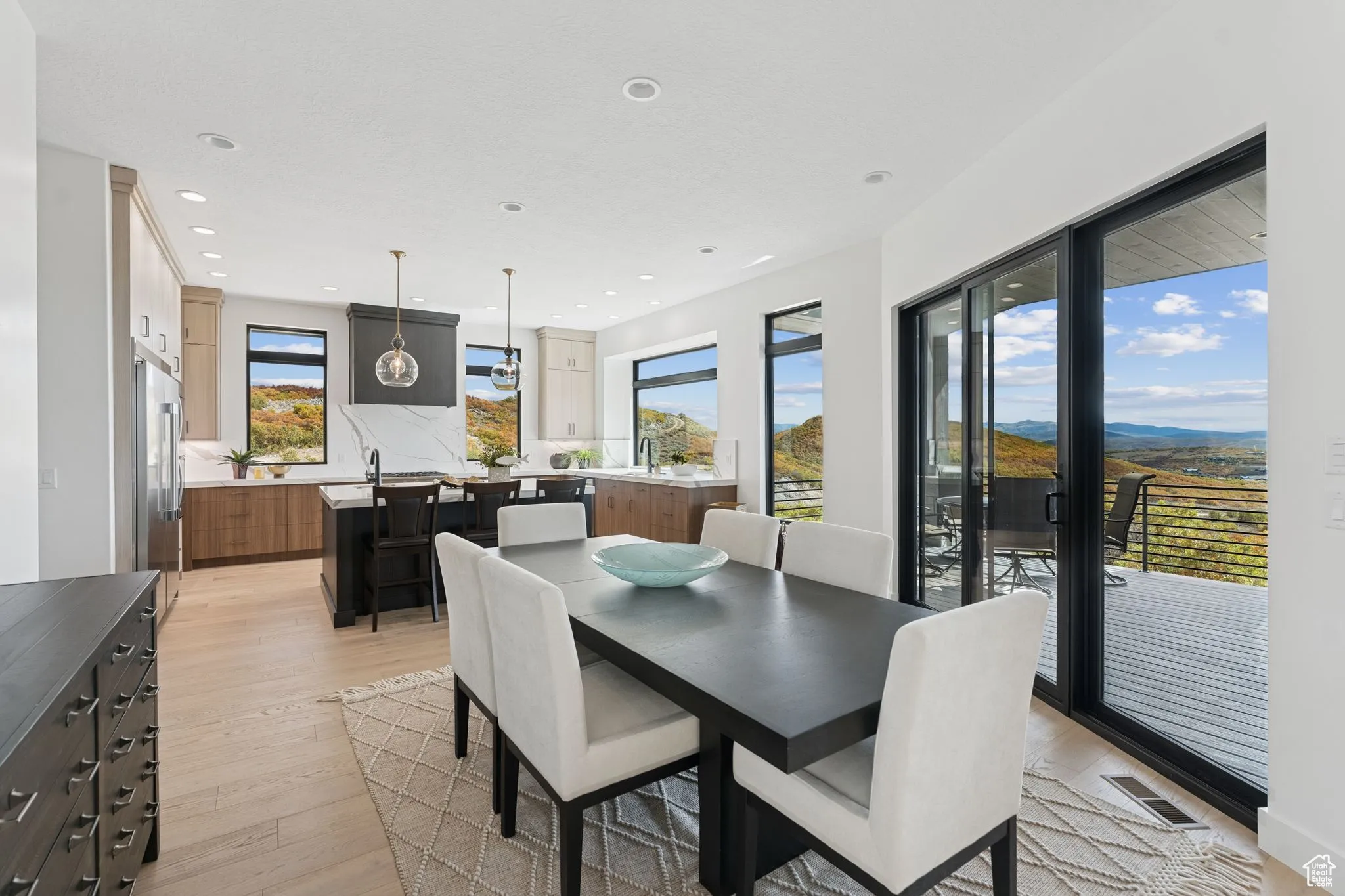 Dining room featuring light wood-style flooring and recessed lighting