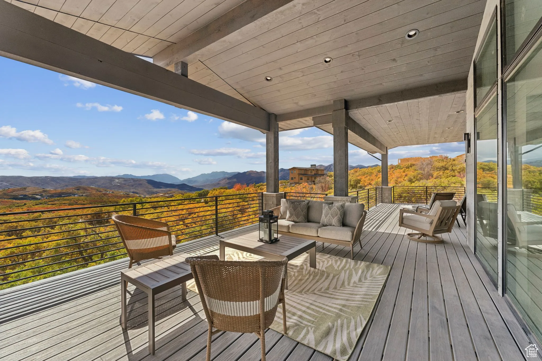 Deck with a mountain view and an outdoor living space