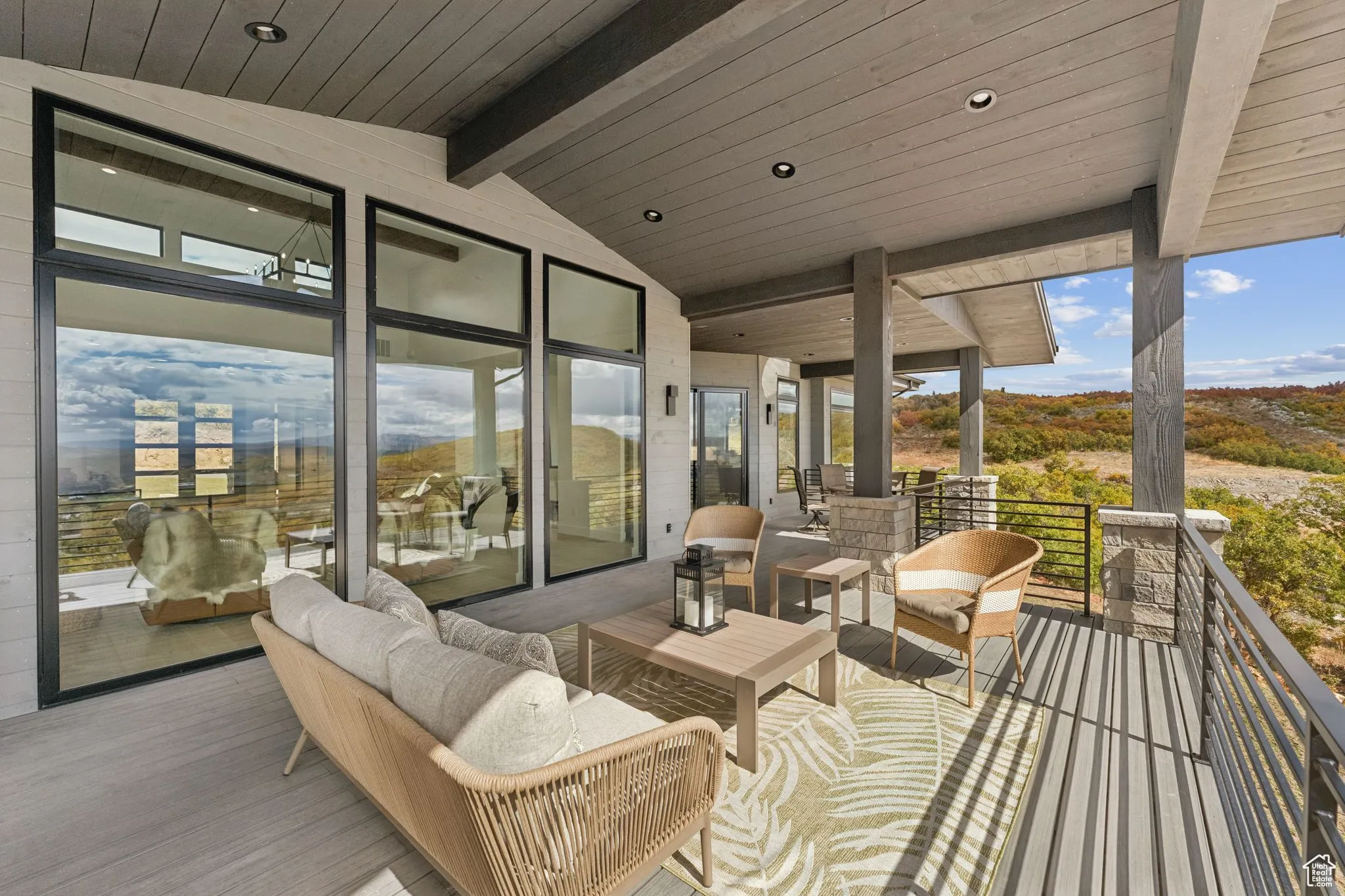 Deck with an outdoor living space and a patio area